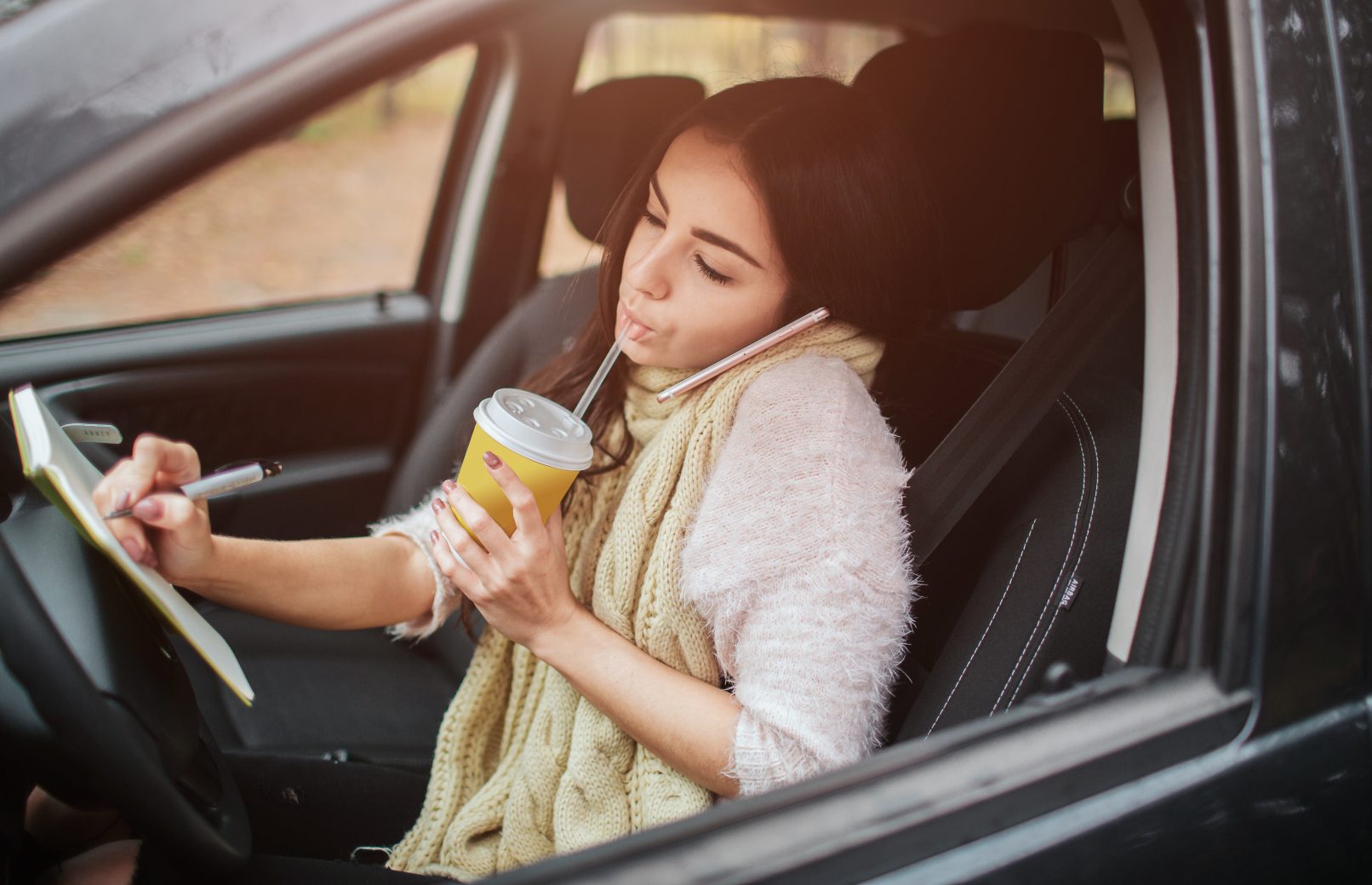 Drink a car. Eating Driving. Eating or drinking in the car.