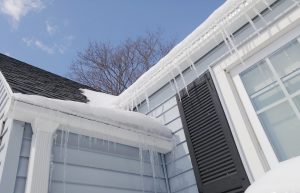 icicles hanging off roof of a house